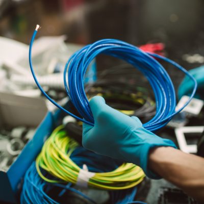 detail-of-a-man-holding-a-roll-of-electric-cable-2026-01-05-00-43-16-utc
